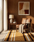 Load image into Gallery viewer, Brown, Cream and Ochre Yellow striped wool rug in a furnished room
