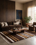 Load image into Gallery viewer, Cream, Ochre Yellow and Dark Brown striped wool rug in a furnished room
