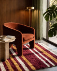Load image into Gallery viewer, Ochre Yellow, Cream and Burgundy striped wool rug in a furnished room
