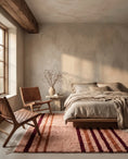 Load image into Gallery viewer, Burgundy, Terracotta and Blush Pink striped wool rug in a furnished room
