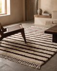 Load image into Gallery viewer, Brown and Cream striped wool rug in a furnished room
