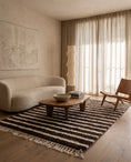 Load image into Gallery viewer, Cream and Dark Brown striped wool rug in a furnished room
