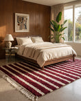 Load image into Gallery viewer, Cream and Burgundy striped wool rug in a furnished room
