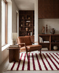 Load image into Gallery viewer, Burgundy and Cream striped wool rug in a furnished room
