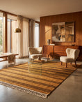 Load image into Gallery viewer, Brown and Ochre Yellow striped wool rug in a furnished room
