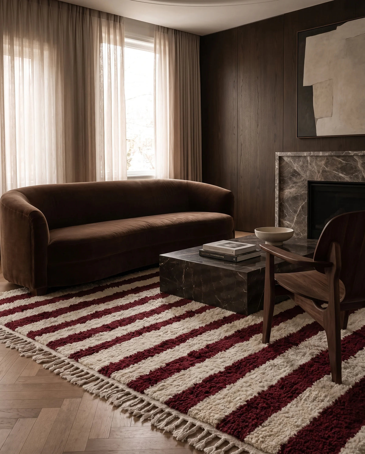 Burgundy and Cream striped wool rug in a furnished room