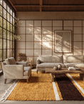 Load image into Gallery viewer, Brown, Cream and Ochre Yellow striped wool rug in a furnished room
