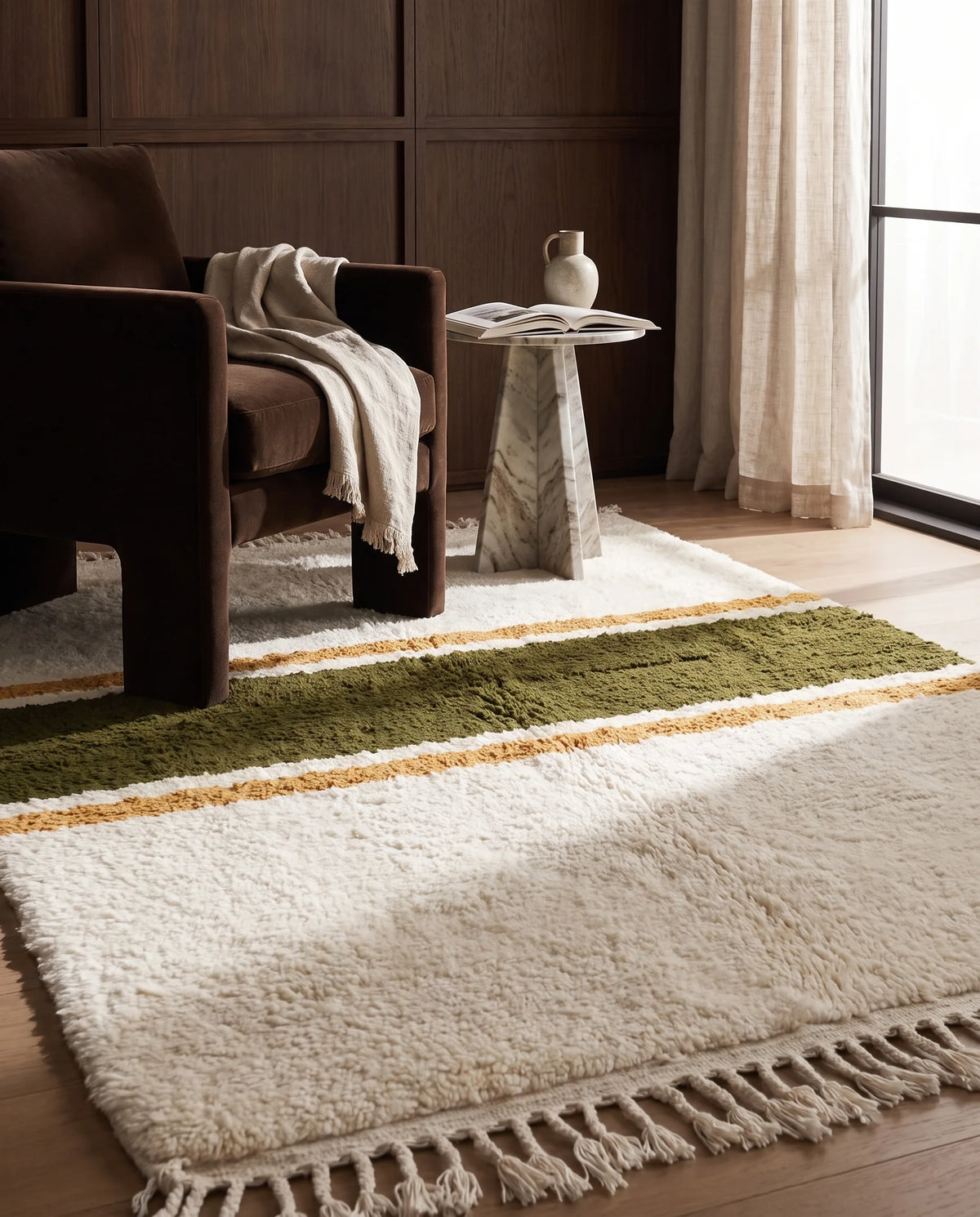 Olive Green, Ochre Yellow and Cream striped wool rug in a furnished room