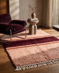 Load image into Gallery viewer, Burgundy, Terracotta and Blush Pink striped wool rug in a furnished room
