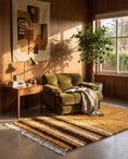 Load image into Gallery viewer, Brown, Cream and Ochre Yellow striped wool rug in a furnished room
