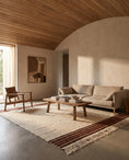 Load image into Gallery viewer, Brown, Terracotta and Cream striped wool rug in a furnished room
