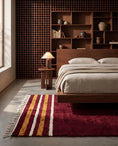 Load image into Gallery viewer, Ochre Yellow, Cream and Burgundy striped wool rug in a furnished room
