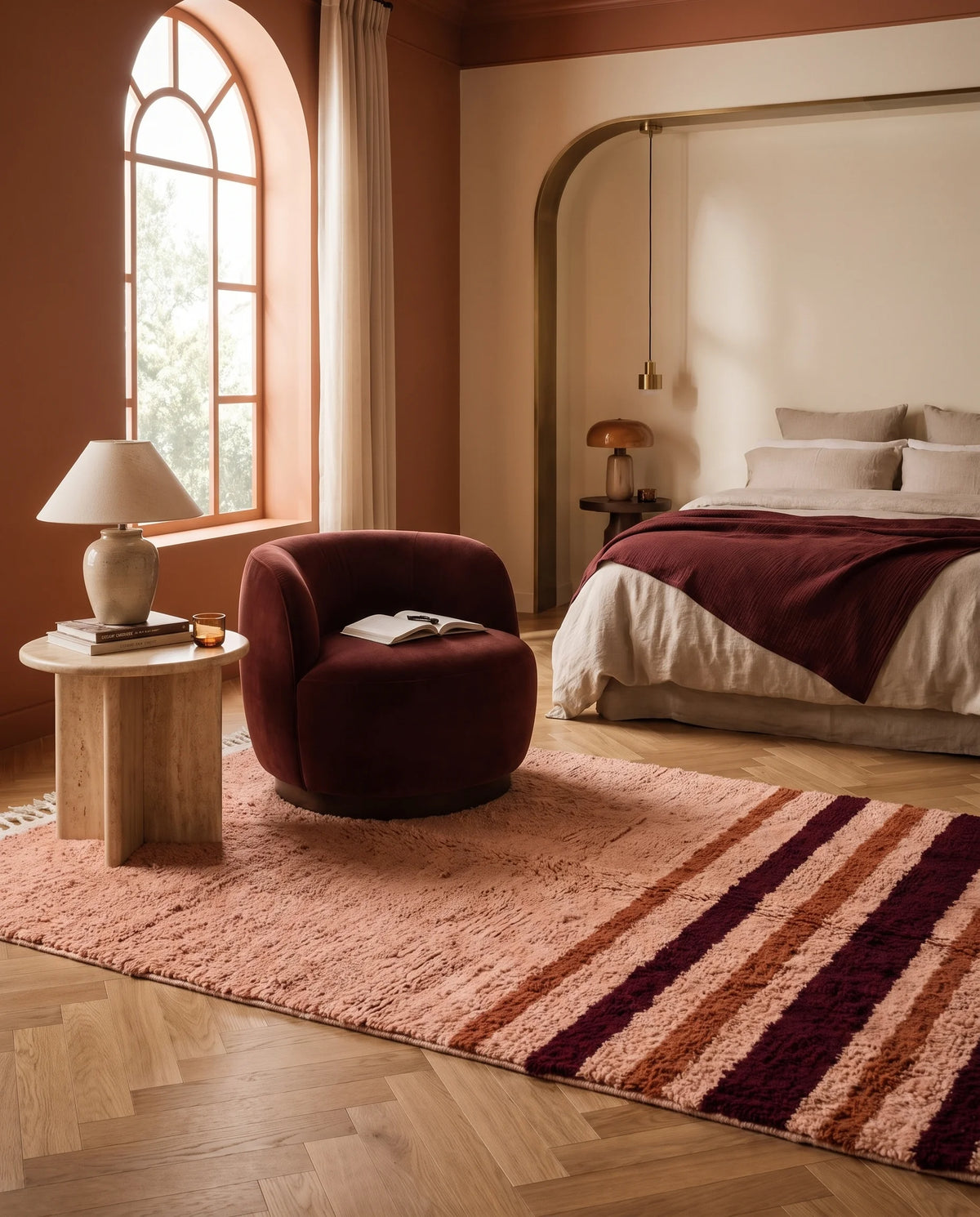 Burgundy, Terracotta and Blush Pink striped wool rug in a furnished room