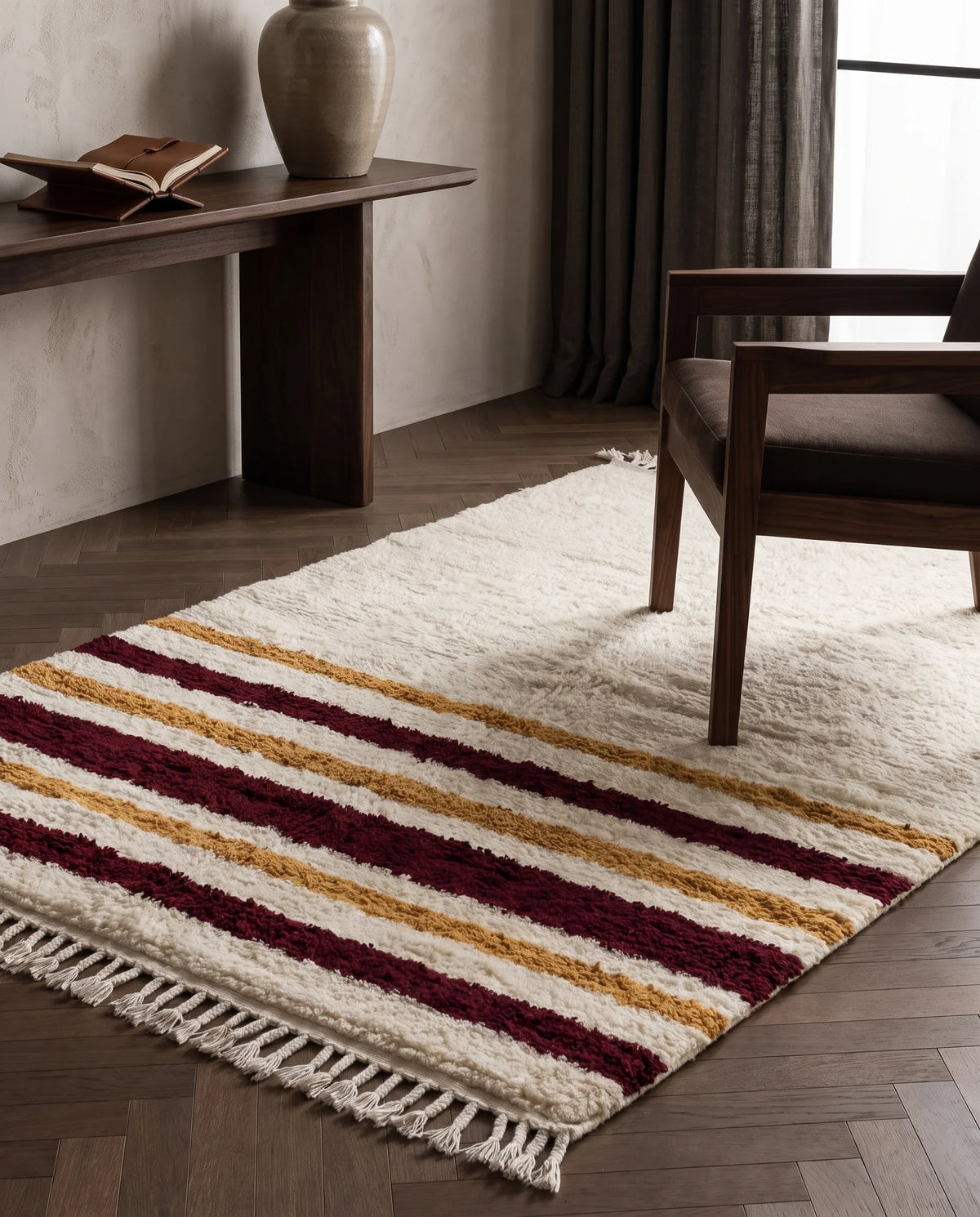Burgundy, Ochre Yellow and Cream striped wool rug in a furnished room
