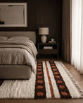 Load image into Gallery viewer, Brown, Terracotta and Cream striped wool rug in a furnished room
