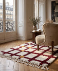 Load image into Gallery viewer, Burgundy, Ochre Yellow and Cream grid wool rug in a furnished room
