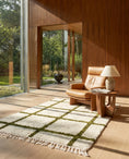 Load image into Gallery viewer, Olive Green and Cream grid wool rug in a furnished room
