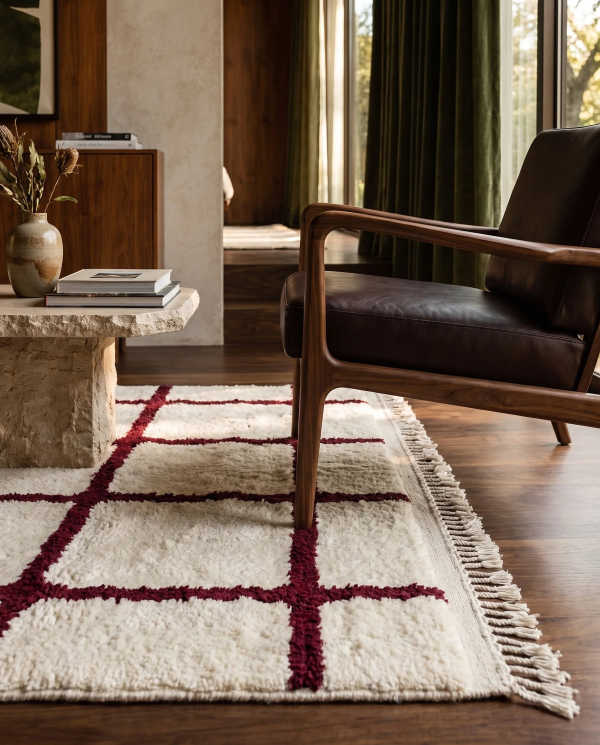 Burgundy and Cream grid wool rug in a furnished room