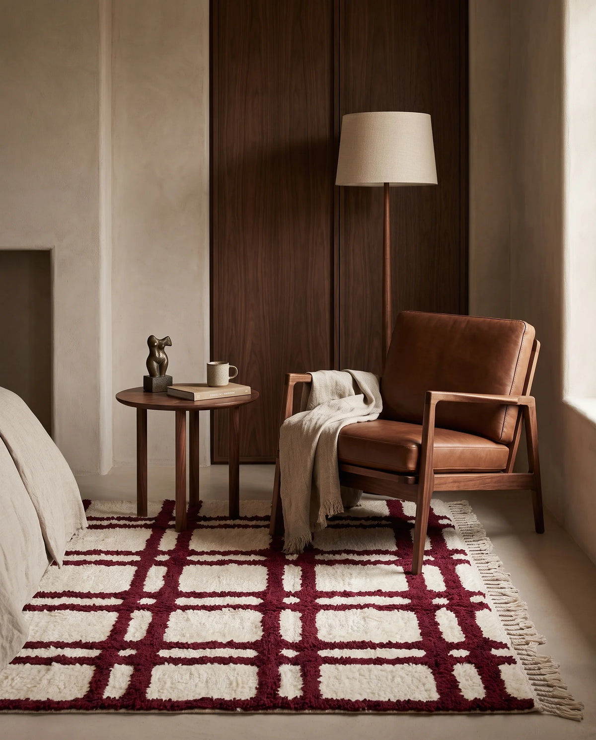 Burgundy and Cream grid wool rug in a furnished room