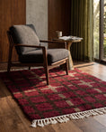 Load image into Gallery viewer, Brown, Taupe and Burgundy grid wool rug in a furnished room
