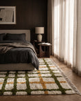 Load image into Gallery viewer, Olive Green, Ochre Yellow and Cream grid wool rug in a furnished room
