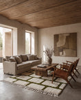 Load image into Gallery viewer, Olive Green and Cream grid wool rug in a furnished room
