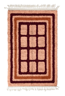 Frame Crossing grid wool rug, oxblood red lines and terracotta accents on blush pink, full view