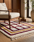 Load image into Gallery viewer, Burgundy, Ochre Yellow and Cream grid wool rug in a furnished room
