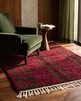 Load image into Gallery viewer, Brown and Burgundy grid wool rug in a furnished room
