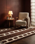 Load image into Gallery viewer, Cream and Dark Brown grid wool rug in a furnished room
