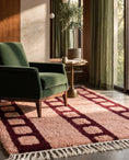 Load image into Gallery viewer, Burgundy and Blush Pink grid wool rug in a furnished room
