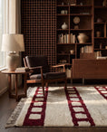 Load image into Gallery viewer, Burgundy and Cream grid wool rug in a furnished room
