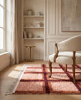 Load image into Gallery viewer, Burgundy, Terracotta and Blush Pink grid wool rug in a furnished room
