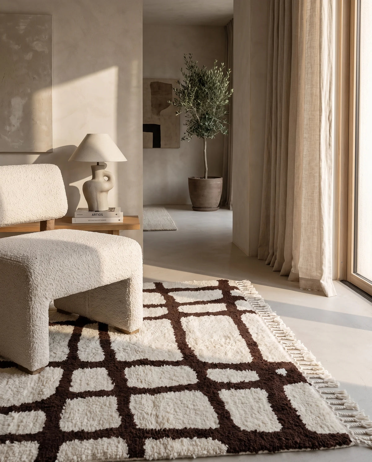 Brown and Cream grid wool rug in a furnished room
