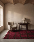 Load image into Gallery viewer, Brown and Burgundy grid wool rug in a furnished room
