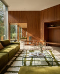 Load image into Gallery viewer, Olive Green and Cream grid wool rug in a furnished room
