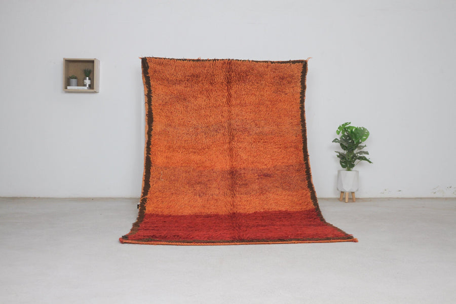 Vintage orange Moroccan rug No. 220, mostly plain field, full view