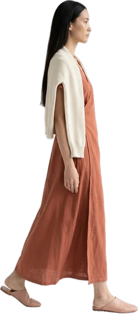 Woman walking: woman with long straight dark hair walking to the right in side profile