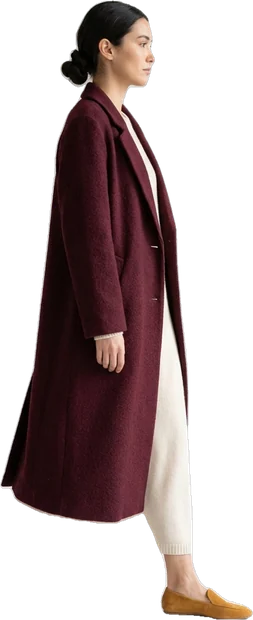 Woman walking: woman with dark hair in bun walking to the right in side profile