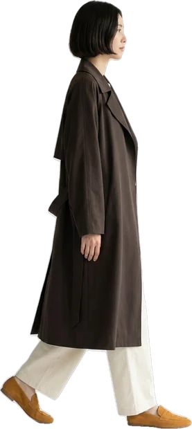 Woman walking: woman with short dark bob hair walking to the right in side profile