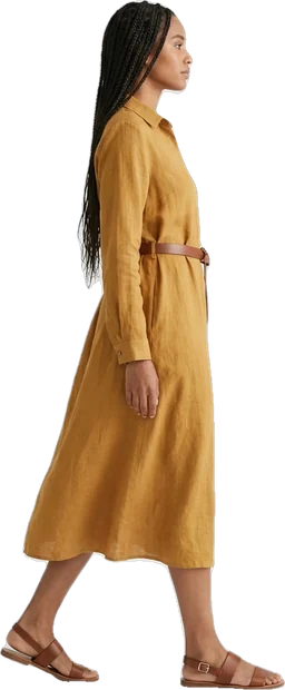 Woman walking: woman with long dark braided hair walking to the right in side profile