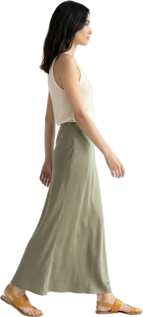 Woman walking: woman with dark hair loose to the shoulders walking to the right in side profile