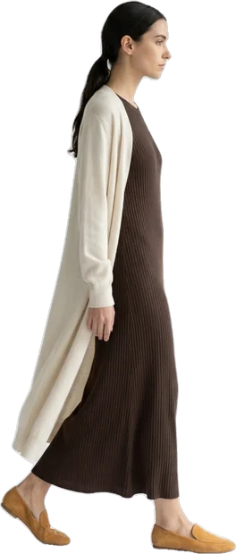 Woman walking: woman with dark hair in ponytail walking to the right in side profile
