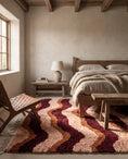Load image into Gallery viewer, Burgundy, Terracotta and Blush Pink wavy wool rug in a furnished room
