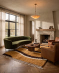 Load image into Gallery viewer, Brown, Cream and Ochre Yellow wavy wool rug in a furnished room
