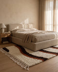 Load image into Gallery viewer, Brown, Terracotta and Cream wavy wool rug in a furnished room
