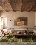 Load image into Gallery viewer, Moss, Sage and Olive Green wavy wool rug in a furnished room
