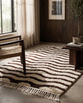 Load image into Gallery viewer, Brown and Cream wavy wool rug in a furnished room
