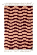 Ripple Tide wavy wool rug, oxblood red waves on blush pink, full view