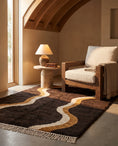 Load image into Gallery viewer, Cream, Ochre Yellow and Dark Brown wavy wool rug in a furnished room
